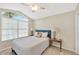 Bright bedroom with a vaulted ceiling, an arched window and neutral colors at 1649 Ledgestone Dr, Brandon, FL 33511