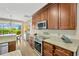 Gourmet kitchen featuring stainless steel appliances and stone countertops at 1649 Ledgestone Dr, Brandon, FL 33511