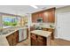 Modern kitchen featuring stainless steel appliances and wooden cabinets at 1649 Ledgestone Dr, Brandon, FL 33511