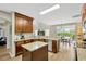 Open kitchen with granite countertops, stainless steel appliances, and island at 1649 Ledgestone Dr, Brandon, FL 33511