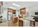Well-equipped kitchen with stainless steel appliances and wooden cabinets at 1649 Ledgestone Dr, Brandon, FL 33511