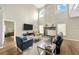 Bright living room featuring high ceilings, a fireplace, and stylish furniture at 1649 Ledgestone Dr, Brandon, FL 33511