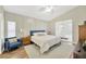 Bright main bedroom featuring paneled walls and natural light at 1649 Ledgestone Dr, Brandon, FL 33511