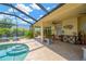 Covered patio featuring stylish decor, comfortable seating, and a relaxing outdoor ambiance at 1649 Ledgestone Dr, Brandon, FL 33511