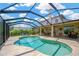Inviting screened-in pool area with ample seating and serene outdoor living space at 1649 Ledgestone Dr, Brandon, FL 33511