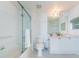 Well-lit bathroom with a tub-shower combo, vanity, and white tile at 16600 Gulf Blvd # 437, North Redington Beach, FL 33708