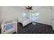 Bright bedroom featuring a ceiling fan, and crib at 16600 Gulf Blvd # 437, North Redington Beach, FL 33708