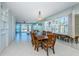Spacious dining room featuring a large table and ocean views at 16600 Gulf Blvd # 437, North Redington Beach, FL 33708