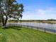 Spacious backyard with mature tree and waterfront view at 18917 Avenue Biarritz, Lutz, FL 33558