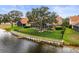 Aerial view of the backyard with enclosed pool and waterfront at 18917 Avenue Biarritz, Lutz, FL 33558