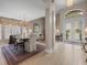 Elegant dining area featuring large windows, chandelier lighting, and an open layout at 18917 Avenue Biarritz, Lutz, FL 33558
