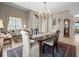 Formal dining room with a chandelier, a neutral color palette, and abundant natural light at 18917 Avenue Biarritz, Lutz, FL 33558