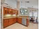 Well-lit kitchen boasting granite countertops, stainless steel appliances, and ample cabinet space at 18917 Avenue Biarritz, Lutz, FL 33558