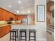 Kitchen featuring stainless steel appliances, granite counters, and a breakfast bar with stool seating at 18917 Avenue Biarritz, Lutz, FL 33558