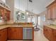 Granite countertops and stainless steel appliances accent this bright kitchen with lots of cabinet storage at 18917 Avenue Biarritz, Lutz, FL 33558