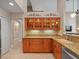This kitchen features granite countertops, wooden cabinets, and ample storage space at 18917 Avenue Biarritz, Lutz, FL 33558