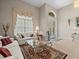 Inviting living room with ample natural light, plush seating, and stylish decor for comfortable living at 18917 Avenue Biarritz, Lutz, FL 33558