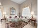 Bright and airy living room featuring comfortable seating, stylish decor, and ample natural light at 18917 Avenue Biarritz, Lutz, FL 33558