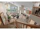 Bright living room with cathedral ceilings, a chandelier, a fireplace, and a view of the pool and backyard at 18917 Avenue Biarritz, Lutz, FL 33558