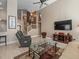 Open-concept living area with high ceilings, a staircase, and comfortable seating for modern living at 18917 Avenue Biarritz, Lutz, FL 33558