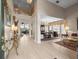 Open-concept living space featuring elegant tile flooring, high ceilings, and natural light at 18917 Avenue Biarritz, Lutz, FL 33558