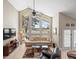 Spacious living room with high ceilings, large windows, and comfortable seating with a waterfront view at 18917 Avenue Biarritz, Lutz, FL 33558