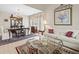 Open-concept living space with dining area, comfortable seating, and stylish decor for modern living at 18917 Avenue Biarritz, Lutz, FL 33558