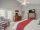 Spacious main bedroom offering hardwood floors, vaulted ceiling, and closet at 18917 Avenue Biarritz, Lutz, FL 33558