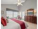 Comfortable main bedroom featuring hardwood floors, vaulted ceiling, and closet at 18917 Avenue Biarritz, Lutz, FL 33558