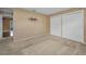 This bedroom features two large closets and neutral walls and carpeting at 2010 Groveland Rd, Palm Harbor, FL 34683