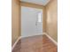 Entryway featuring a white front door, wood-look floors, and neutral-toned walls at 2010 Groveland Rd, Palm Harbor, FL 34683