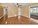Open living room featuring wood flooring, recessed lighting, with views to the kitchen and porch at 2010 Groveland Rd, Palm Harbor, FL 34683