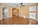 Open living room featuring wood flooring, recessed lighting, with views to the kitchen and entry hall at 2010 Groveland Rd, Palm Harbor, FL 34683