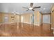 Open living room featuring wood flooring, recessed lighting, with views to the kitchen and entry hall at 2010 Groveland Rd, Palm Harbor, FL 34683