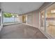 Screened-in patio offers an unobstructed view of the backyard and home's interior at 2010 Groveland Rd, Palm Harbor, FL 34683