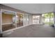 Enclosed patio features durable flooring and connects seamlessly to the home's interior at 2010 Groveland Rd, Palm Harbor, FL 34683