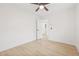 Bedroom with light hardwood floors, and a view to the bathroom at 2017 Rebecca Dr, Clearwater, FL 33764