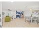 Open-concept living room showcasing a dining area and kitchen with lots of natural light from the windows at 2017 Rebecca Dr, Clearwater, FL 33764