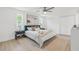 Serene bedroom featuring neutral tones, and a luxurious queen-sized bed for relaxation at 2017 Rebecca Dr, Clearwater, FL 33764