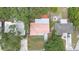 Aerial view of a single-Gathering home showcasing its backyard, roof and proximity to neighboring homes at 2333 Indigo Dr, Clearwater, FL 33763