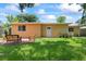 The backyard features a well-maintained lawn and patio area at 2333 Indigo Dr, Clearwater, FL 33763