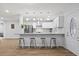 Bright kitchen with an island that seats four, stainless steel appliances, and modern finishes at 2333 Indigo Dr, Clearwater, FL 33763