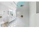 Bathroom with decorative tile floor, stylish vanity, and large shower at 2401 Roberta Ln, Clearwater, FL 33764