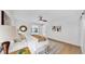 Bright main bedroom with sliding barn door and unique area rug at 2401 Roberta Ln, Clearwater, FL 33764