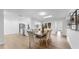 Dining room featuring hardwood floors, modern furniture, and an open view to the kitchen at 2401 Roberta Ln, Clearwater, FL 33764