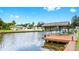 A waterfront home featuring a private dock and canal access for boating and enjoying waterfront living at 2401 Roberta Ln, Clearwater, FL 33764