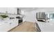 Modern kitchen features stainless appliances, quartz countertops and flows to an outdoor pool area at 2401 Roberta Ln, Clearwater, FL 33764