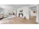 Open living room showcasing modern decor, hardwood floors, and abundant natural light at 2401 Roberta Ln, Clearwater, FL 33764