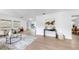 Bright and airy living room with modern decor and an open layout, showcasing the seamless flow at 2401 Roberta Ln, Clearwater, FL 33764