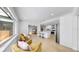 Open floor plan shows living room and kitchen area with island seating, connecting different spaces in the home at 2401 Roberta Ln, Clearwater, FL 33764